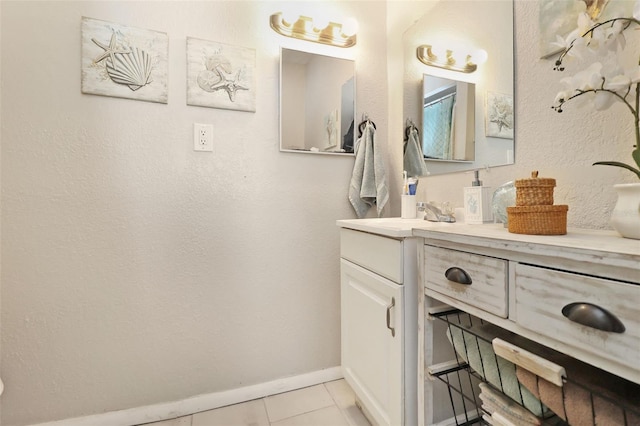 bathroom featuring tile patterned floors and vanity