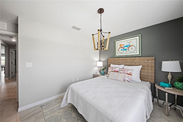 bedroom with a notable chandelier