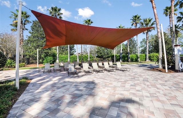 view of property's community with a patio area