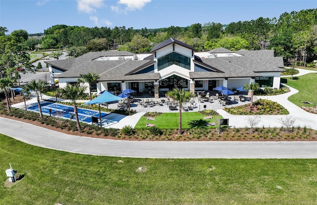 exterior space featuring a patio area and a lawn