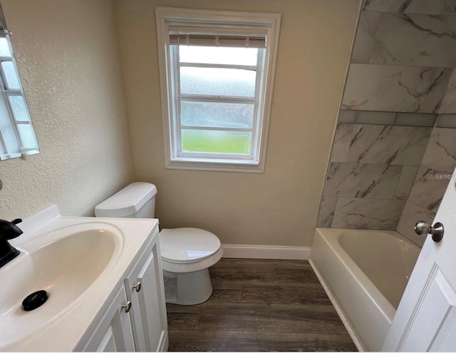 bathroom featuring vanity, hardwood / wood-style flooring, and toilet