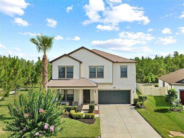 view of front of house with a garage and a front yard