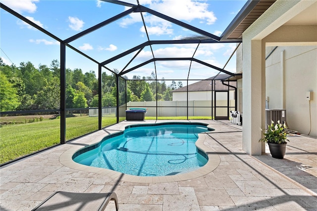 view of swimming pool with glass enclosure, a yard, cooling unit, and a patio