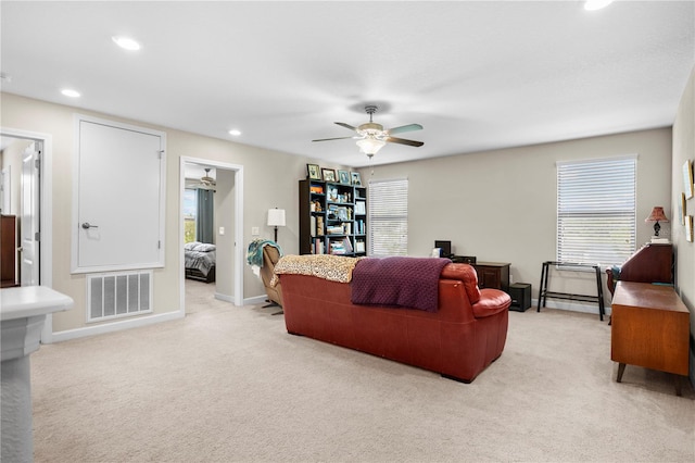 living room featuring ceiling fan and light colored carpet