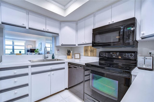 kitchen with crown molding, sink, black appliances, light tile patterned floors, and white cabinetry