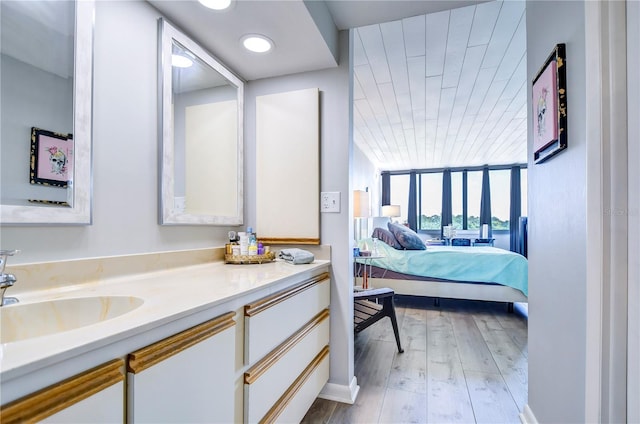 bathroom featuring vanity and hardwood / wood-style flooring