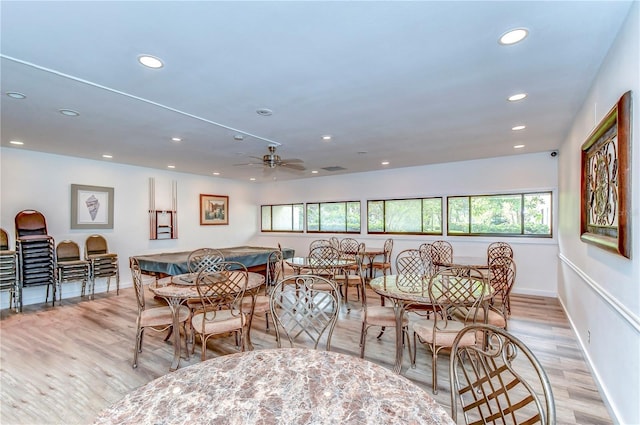 dining room with plenty of natural light and light hardwood / wood-style flooring