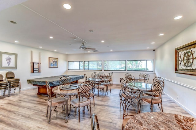 dining area with light hardwood / wood-style floors, ceiling fan, and pool table