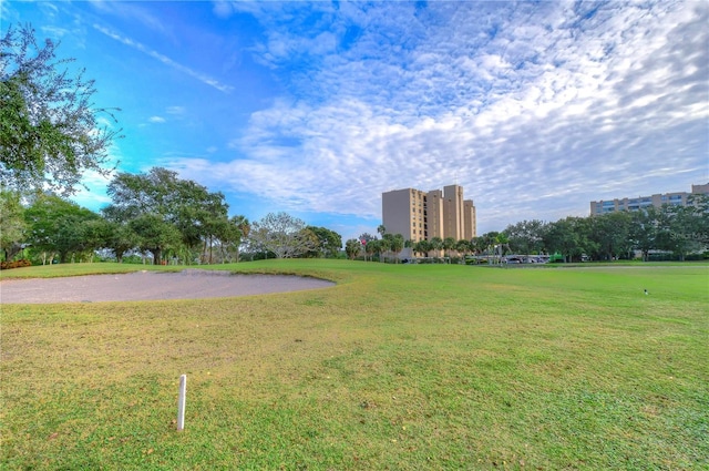 view of property's community with a lawn