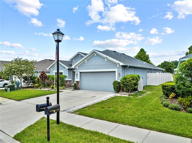 view of front of house with a garage and a front lawn