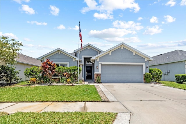 view of front facade with concrete driveway, an attached garage, a front yard, and stucco siding