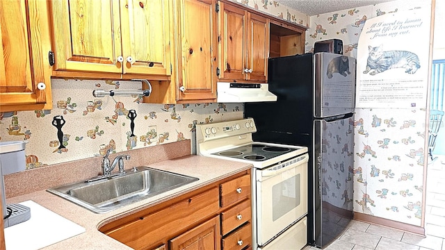 kitchen featuring light tile patterned floors, electric range, sink, and a textured ceiling