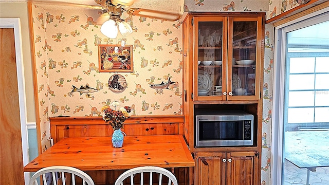 dining space featuring ceiling fan