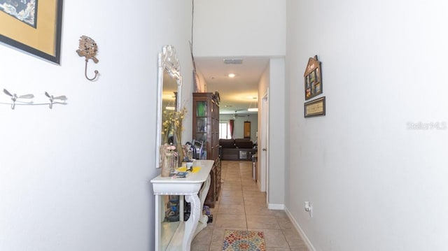 corridor featuring light tile patterned floors