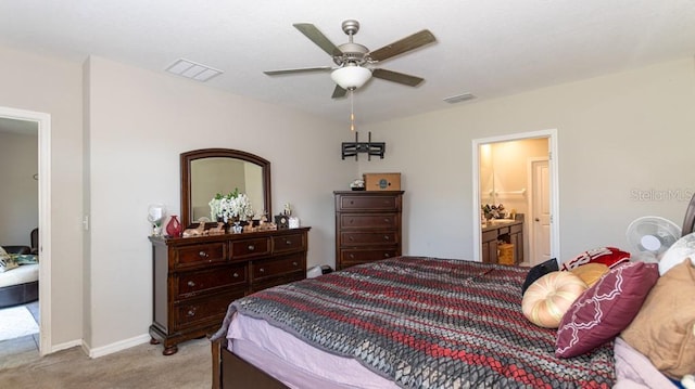 carpeted bedroom featuring connected bathroom and ceiling fan