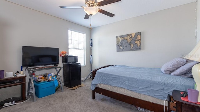 bedroom featuring light carpet and ceiling fan