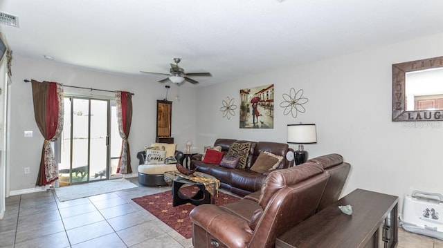 tiled living room featuring ceiling fan