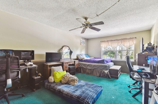 bedroom featuring ceiling fan, carpet floors, and a textured ceiling