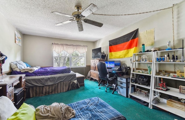 bedroom with ceiling fan, carpet, and a textured ceiling