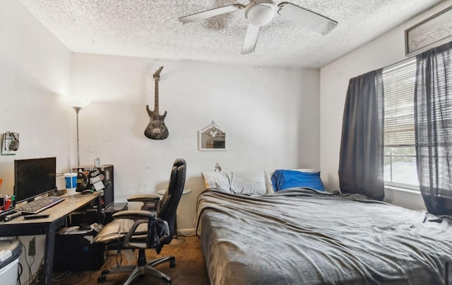 carpeted bedroom with multiple windows, ceiling fan, and a textured ceiling