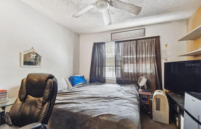 bedroom with carpet, ceiling fan, and a textured ceiling