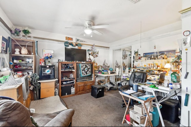 carpeted office space featuring ceiling fan