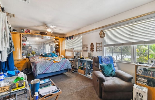 carpeted bedroom with ceiling fan