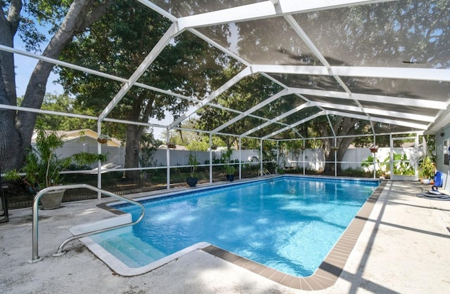 view of pool featuring a patio and a lanai