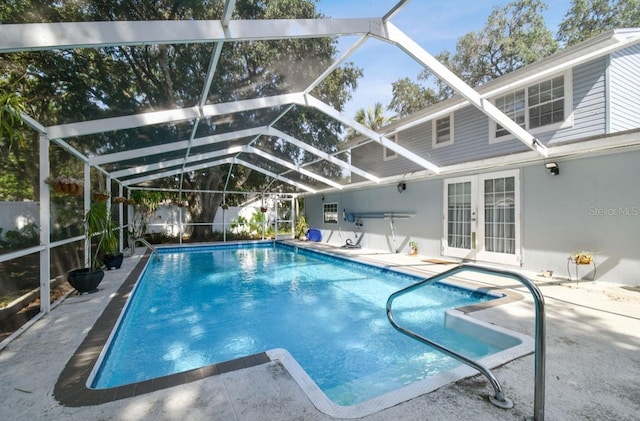 view of pool featuring a lanai, french doors, and a patio