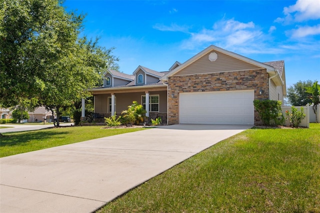 view of front of property featuring a garage and a front yard