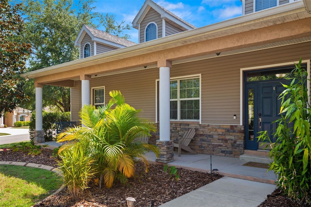 doorway to property with covered porch