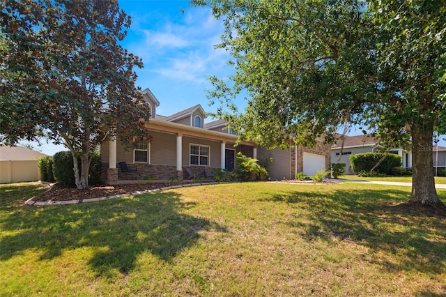 view of front of property featuring a garage and a front lawn