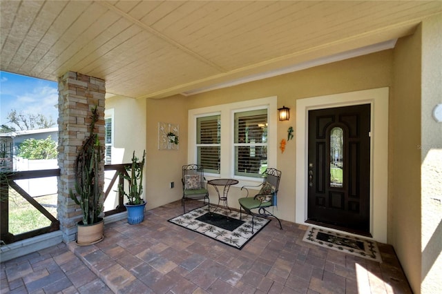 2628 River Bend Dr, Ruskin, FL 33570 - doorway to property featuring covered porch