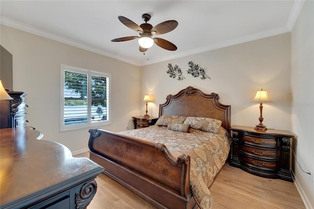 2628 River Bend Dr, Ruskin, FL 33570 - bedroom with ceiling fan, light wood-type flooring, and crown molding