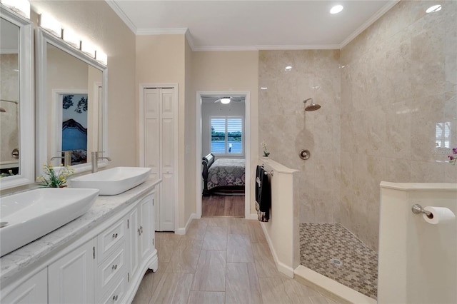 2628 River Bend Dr, Ruskin, FL 33570 - bathroom featuring hardwood / wood-style floors, vanity, a tile shower, and ornamental molding