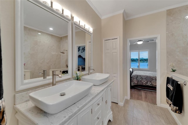 2628 River Bend Dr, Ruskin, FL 33570 - bathroom featuring ceiling fan, ornamental molding, a water view, vanity, and hardwood / wood-style flooring