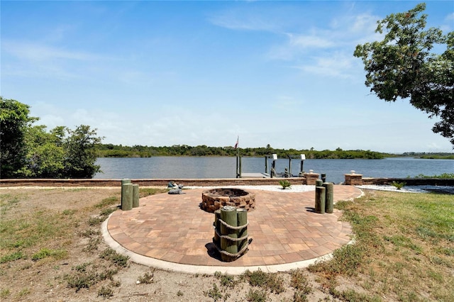 2628 River Bend Dr, Ruskin, FL 33570 - view of patio with a water view and a fire pit