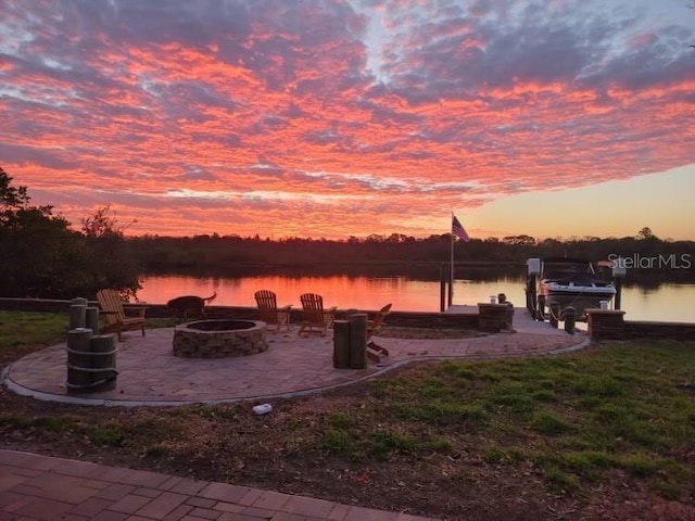 2628 River Bend Dr, Ruskin, FL 33570 - exterior space with a water view, a fire pit, and a boat dock
