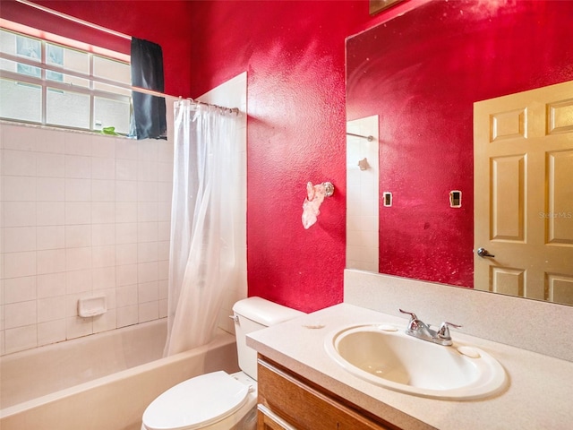 full bathroom with vanity, toilet, and shower / bath combo with shower curtain