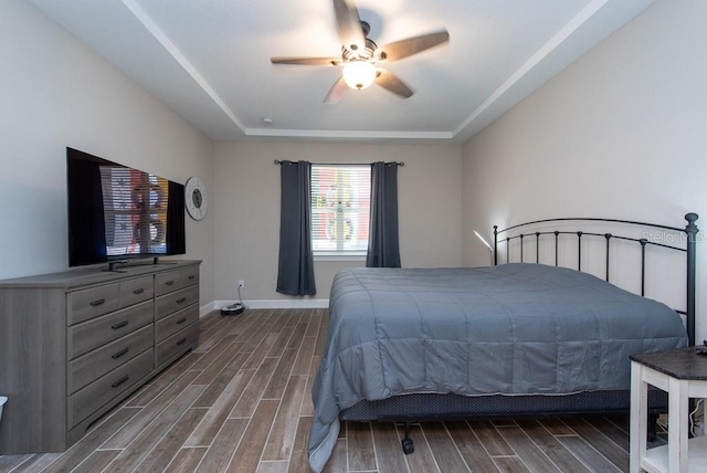 bedroom featuring dark wood-type flooring and ceiling fan