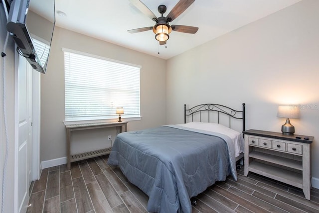 bedroom featuring dark hardwood / wood-style flooring, a closet, and ceiling fan