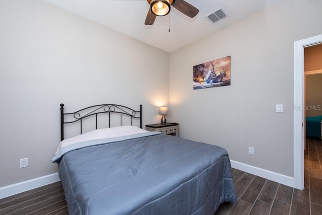 bedroom with ceiling fan and dark hardwood / wood-style floors