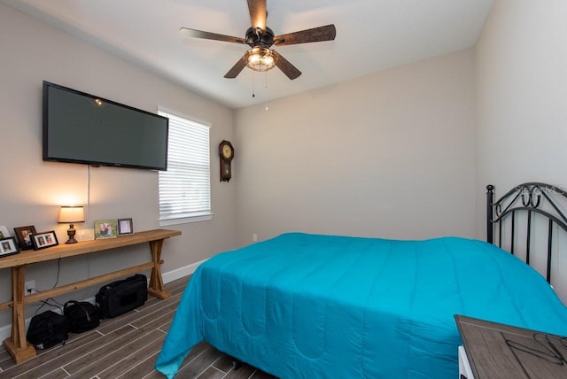 bedroom featuring ceiling fan and dark hardwood / wood-style floors