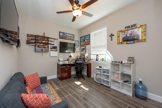 office area with dark wood-type flooring and ceiling fan