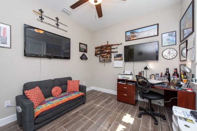 home office featuring ceiling fan and dark hardwood / wood-style floors