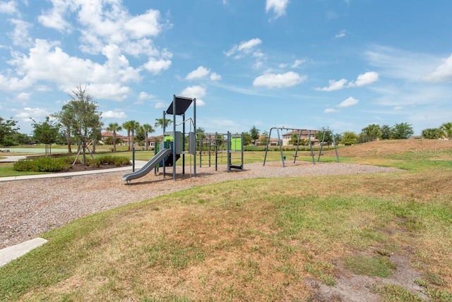 view of playground with a lawn