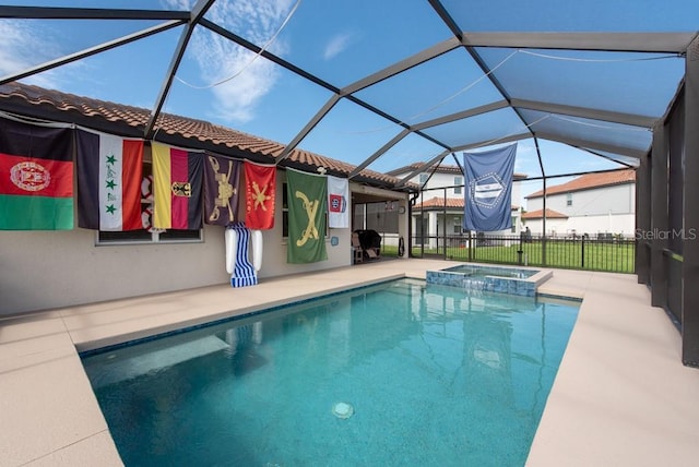 view of swimming pool with a patio, an in ground hot tub, and glass enclosure