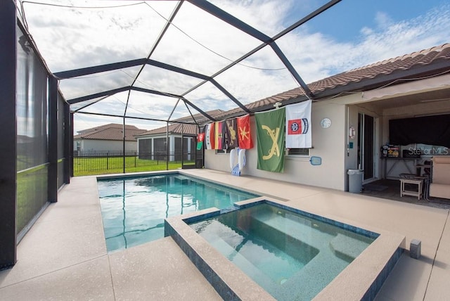 view of swimming pool featuring a lanai and a patio