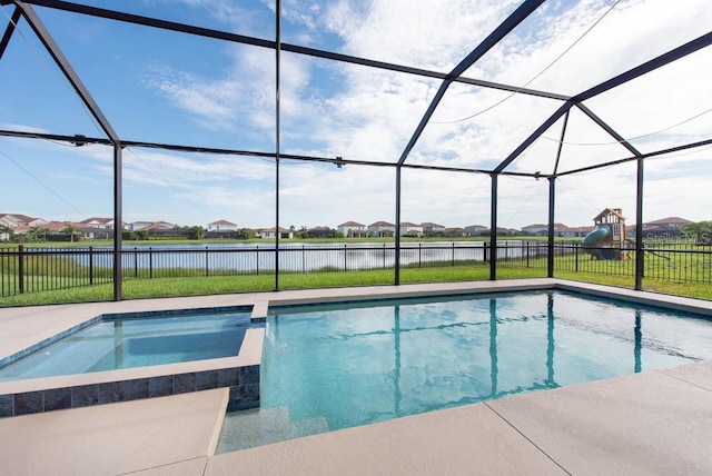 view of swimming pool with an in ground hot tub and glass enclosure