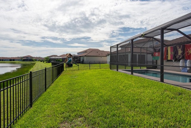 view of yard with a lanai and a fenced in pool